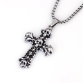 Detailed macro shot of gothic skull cross pendant with vintage blackened steel finish - Multi Skull Cross with Steel Chain