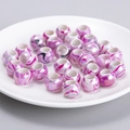 Macro shot of liquid marble pattern large hole acrylic beads in pink and purple tones - Pink White Marble