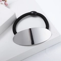 Macro shot of silver mirrored oval alloy charm on high-elasticity black hair tie - Oval (c6104) / Oval Silver