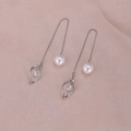 Detail of silver tassel earrings with white pearls and leaf-shaped rhinestone charms - Single Twisted Silver A1211
