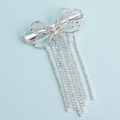 Silberne Schleifen-Haarspange mit glitzernden Strass-Quasten und elegantem Hohlmetalldesign - Silber