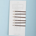 Set of 6 minimalist brown and gold bobby pins on a white display card with blue background - Short Brown Set (E6526)