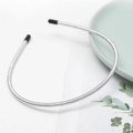 Close-up of silver thin headband with metallic wire texture and black rubber tips - Silver (E2506)