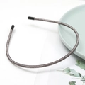 Detail of slim dark grey wire headband with protective rubber tips on ceramic plate - Gray (E2508)