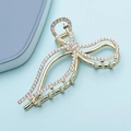 Elegante gouden haarklem in strikvorm met fonkelende steentjes voor een luxe uitstraling - Strass Stijl (M2414)
