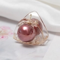 Close-up of a geometric triangle hair claw clip with a metallic pink bead decoration - Pink Rose Gold Style (F043001-3# H7507)