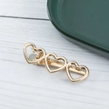 Eleganter Haarausschnitt aus Goldlegierung mit drei hohlen Herzformen für süßen Korea-Stil - Goldene Herzform (E1529)