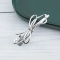 Detail of silver alloy bow hair clip with hollow design and anti-slip duckbill clamp - Silver Bow knot (E1523)