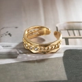 Detailed close-up of wavy gold ring with textured beads and four clear zircon stones - Wavy Beaded Texture Style (L3404) / Gold