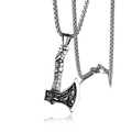 Macro shot of vintage Viking axe pendant with wolf engraving and rustic texture details - Axe + Stainless Steel Chain