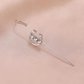 Detailed view of silver-plated ear crawler with five sparkling crystals on silk fabric - C-Shape Silver