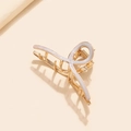 Dettaglio di una pinza per capelli in metallo dorato con design a croce in smalto bianco - Bianco (G9404)