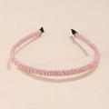 Pink pleated fabric headband with comfortable black protective tips on a neutral base - Pink