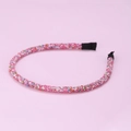 Detailed macro shot of pink headband featuring vibrant multi-colored micro-bead embellishments - Pink