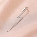 Macro shot of a silver lightning bolt ear cuff featuring sparkling pave-set zircons - Lightning Silver