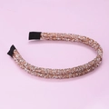 Dettaglio del cerchietto con strass oro champagne e terminali in nastro nero antiscivolo - Champagne (E4412)
