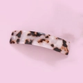 Polished leopard print acetate hair clip with tortoiseshell pattern on pink background - Leopard Print