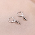 Minimalist silver huggie hoop earrings with bullet spike pendants on pink satin fabric - Silver
