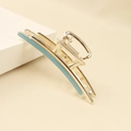 Detail of light blue enamel inlay on a polished gold alloy shark hair claw clip - Blue (C5107)