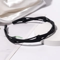 Foldable black headband with matte finish and non-slip teeth for secure hair styling - Black