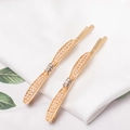 Eleganti fermagli per capelli dorati con perle e strass su tessuto bianco - Oro