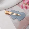 Detail of blue acetate heart hair clip with glitter effect and gold metal duckbill clamp - Blue