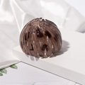 Detail of tortoise shell bird nest hair clip with flexible expanding resin design - Translucent Spotted Retractable Design / Amber (E5216)