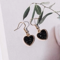Fashionable gold heart drop earrings with black resin druzy stones on a floral background - Black (E6211)