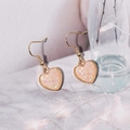 Macro shot of gold-plated heart earrings with sparkling resin crystals and beaded edge - Light Pink (E6217)