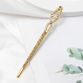 Detailed macro view of vintage alloy hair stick with antique gold finish and floral relief - Geometric Hollow Relief Style (C1329)