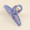 Detail of large marble resin hair claw clip with blue-purple texture and gold spring - Blue