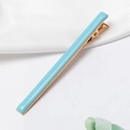 Sky blue macaron duckbill hair clip with golden metal base on white silk background - Blue