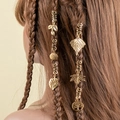 Detailed close-up of golden spiral hair clips and tree of life charms on braided hair - Vintage Hollow Leaf Pendant Style (E7524)