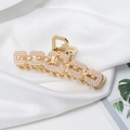 Elegant gold metal hair claw clip with pearl chain design on white silk fabric background - Rectangular Pearl Style (B8133)