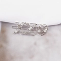Close-up of silver metal hair clip with YIBO letter XZ and sparkling pearl hearts - XZ Silver