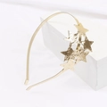Golden metal headband with hammered star charms on white minimalist geometric stand - Gold (C8218)