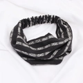Detail of black and white striped knitted headband with cross design and elastic texture - Black Stripe
