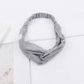 Close-up of gray ribbed knit headband with white buttons for mask and twist knot detail - Gray