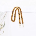 Detailed close-up of tortoise shell acrylic chain with gold clasps and rubber loops - Tortoiseshell Gold (K3401)