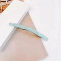 Detail of light green marble texture acetate hair clip with silver spring mechanism - Sky Blue