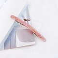 Detailed macro view of pink marble acetate hair clip with premium metal spring barrette - Light Pink