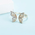 Detail of gold butterfly open ring with sparkling crystal pave wings on blue backdrop - Adjustable Open / Gold Style (D7231)