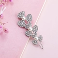 Sparkling rhinestone flower hair clip with pearls on a pink textured background - Three Leaf Flower Silver Color (B3511)