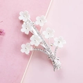 Close-up of a silver floral hair clip with white petals and shimmering rhinestones - Plum Blossom Shape Silver Color (B3504)