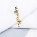 Detailed macro view of vintage gold spiral hair coil with a flamingo pendant charm - Vintage Flamingo Style (E7528-19#)