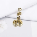 Macro shot of vintage gold spiral dreadlock hair clip with hollow filigree butterfly pendant - Hollow Engraved Wings Style (E7525-8#)