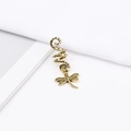 Detail of vintage bronze spiral hair coil with a delicate dragonfly pendant on white fabric - Vintage Texture Dragonfly Style (E7530-17#)