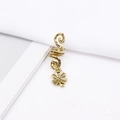 Detailed macro view of a golden spiral hair ring featuring a clover charm and vintage texture - Distressed Texture Clover Style (E7530-18#)