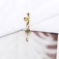 Detailed close-up of a vintage golden key pendant hair ring accessory for dreadlocks - Vintage Hollow Key Style (E7522-20#)