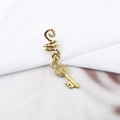 Detailed macro view of vintage gold spiral hair rings with a delicate key pendant - Woven Texture Small Key Style (E7522-24#)